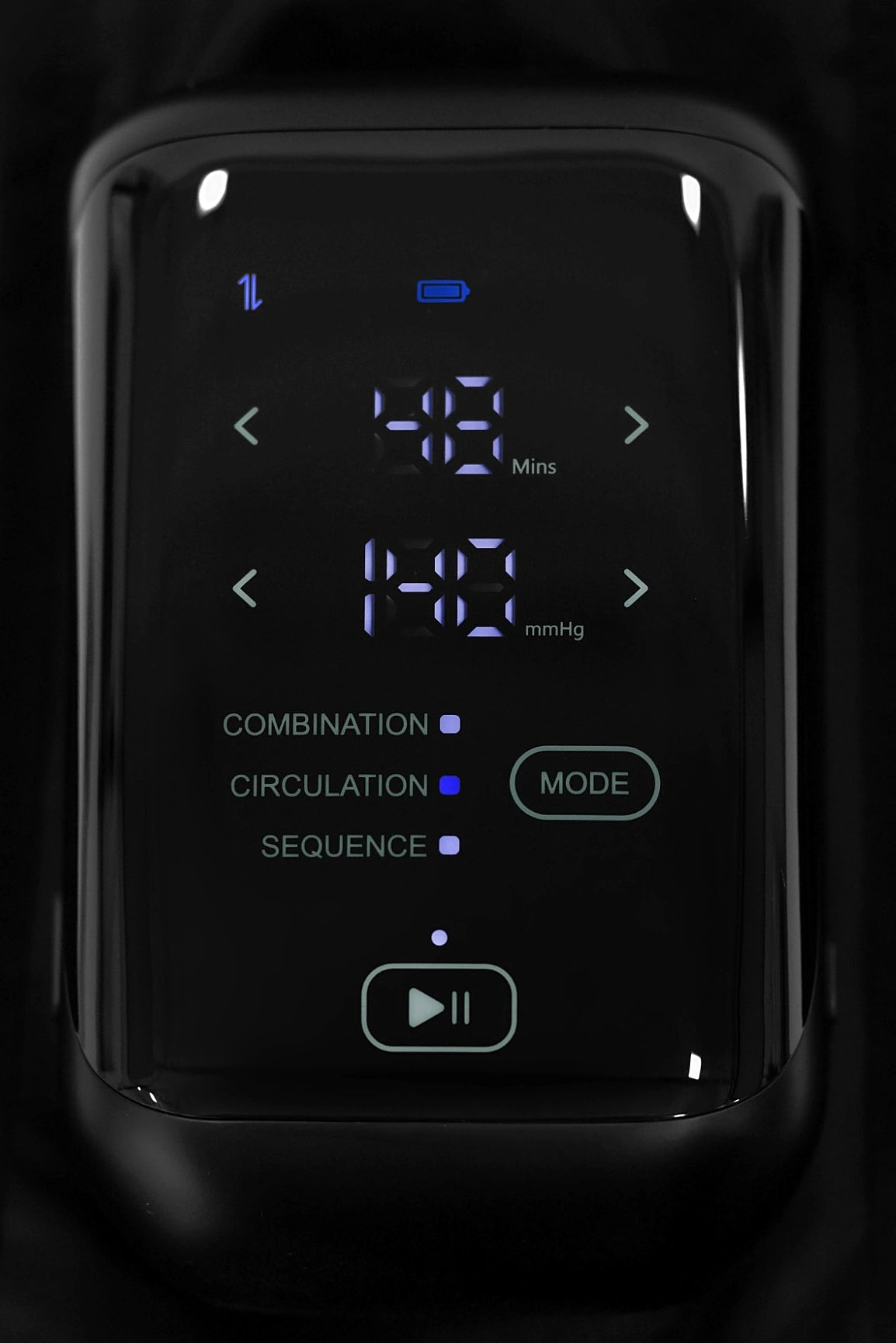 The AG-01's smart LED controller: session timer, live pressure readout in mmHg, and Combination, Circulation and Sequence massage modes